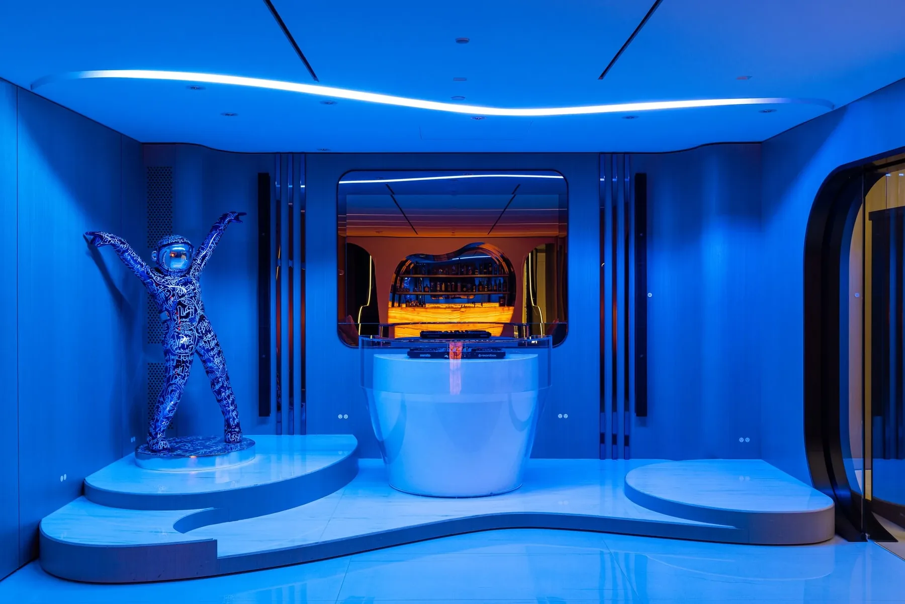 A blue-lit hospitality interior with concealed audio